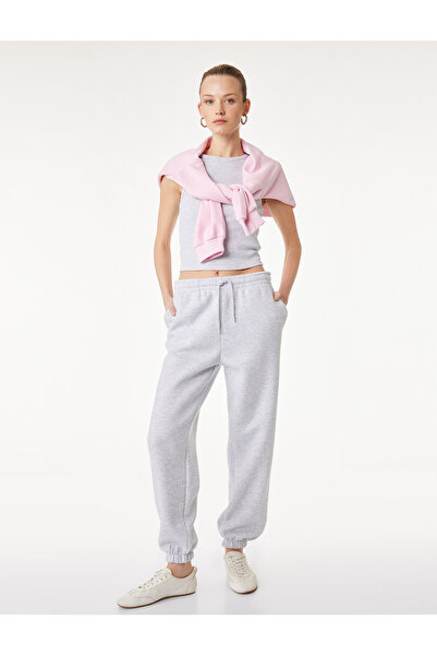 Koton Φόρμα τζόγκερ με τρεις ρίγες, ελαστικές τσέπες στα πόδια και λεπτομέρει...