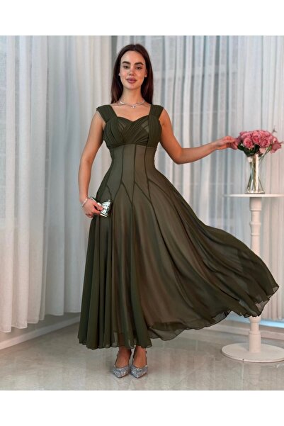 ELEEN EST An elegant olive-green dress with a soft design and a distinctive n...