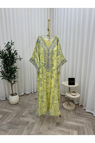 NALA FASHION A warm golden yellow jalabiya gives her a bright and striking pr...