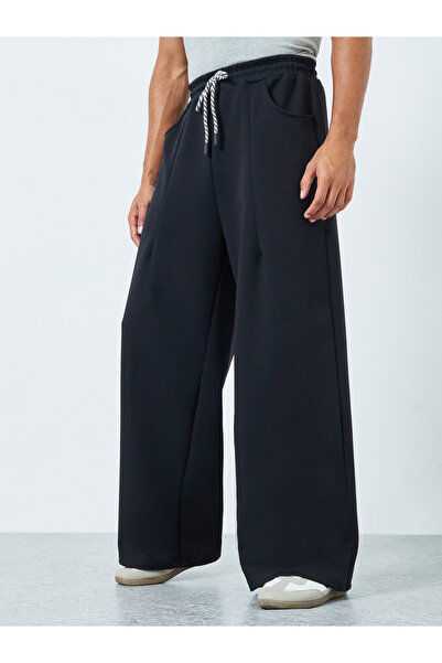 Styli Men Wide Leg Joggers with Back Pocket Detail