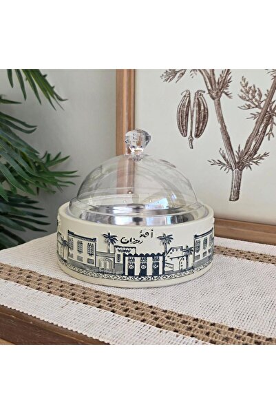 QUEEN A serving dish made of plaster, with the phrase "Welcome Ramadan" writt...