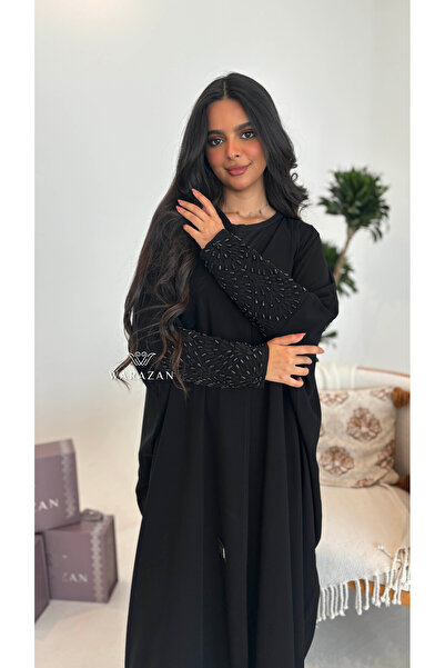 Warazan An abaya with an elegant style and embroidered details on the sleeves.