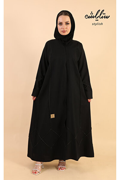 Stylish A stylish, elegant, classic abaya in black, adorned with gold accents.