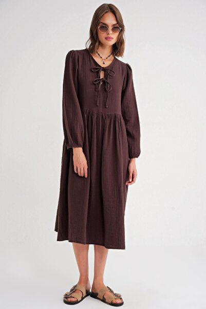 Hiccup Mixray midi dress with V-neck and knot closure, loose fit