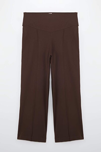 Trendyol Curve Pantaloni maro din țesătură moale, cu picior larg, mărime mare...
