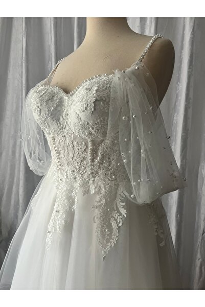 AYŞE KOÇYİĞİT Omuzda İnci serpmeli detaylı Transparan Maxi Helen Gelinlik