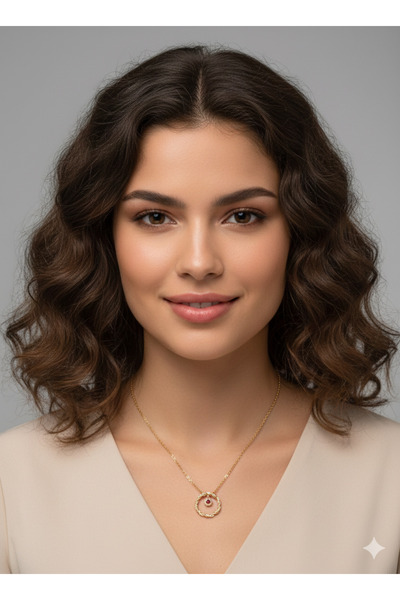 burjalmodah An elegant gold necklace with a circular twist design and a spark...