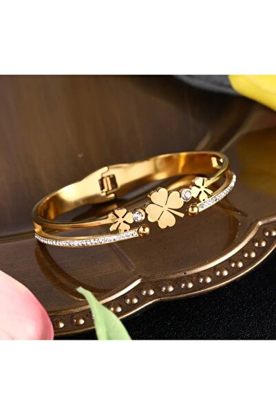 stainless steell gold renk yonca motifli taş detaylı çelik kelepçe bileklik