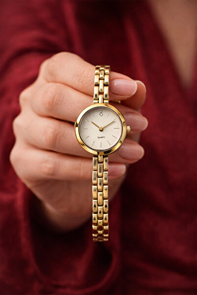 İnogge ساعة يد نسائية فاخرة من بروداز جولد مينيمال بمينا أبيض وتفاصيل حجرية