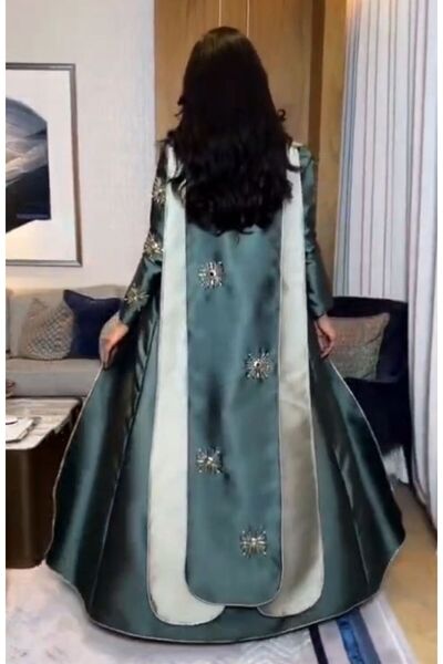 NALA FASHION An elegant, heritage-inspired dress in dark green.