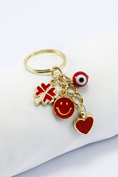 biuti سلسلة مفاتيح معدنية صغيرة بلون ذهبي مع حلية على شكل وجه مبتسم وعين شرير...