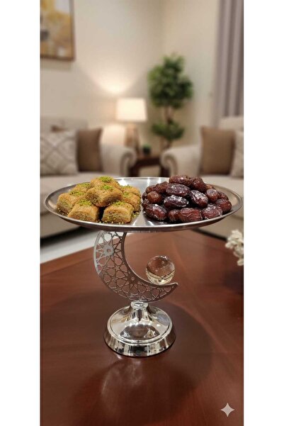 Noor A decorative crescent-shaped metal serving dish for Ramadan hospitality