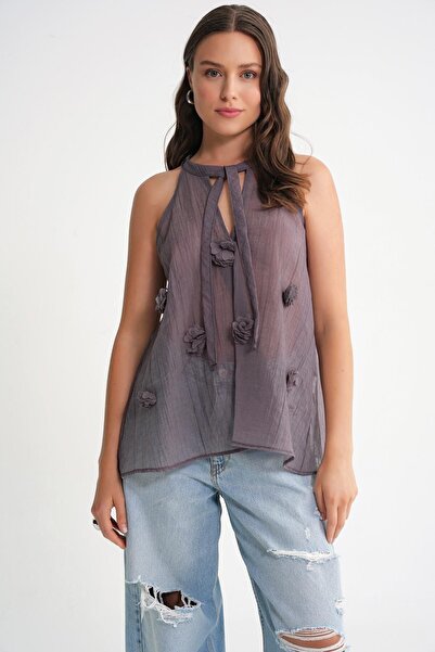 Hiccup Mixray V-neck blouse with knot closure and ruffles