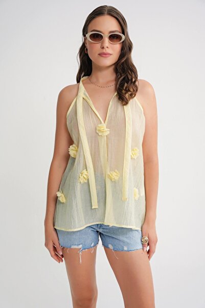 Hiccup Mixray V-neck blouse with knot closure and ruffles