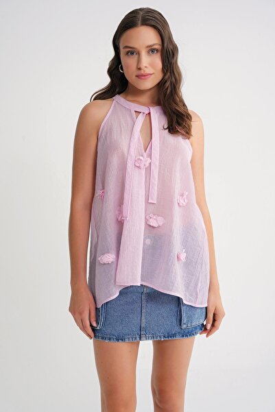 Hiccup Mixray V-neck blouse with knot closure and ruffles