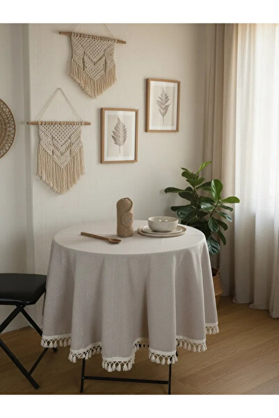 NDC HOME مفرش المائدة المستدير من Pompom باللون البيج