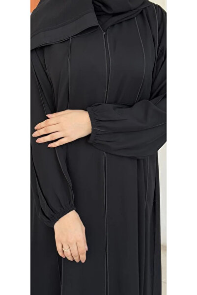 Abay-ti A black abaya with a touch of luxurious cord… details that speak of e...