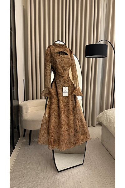 Nareen Fashion An elegant dress in a warm brown color with a subtle artistic ...