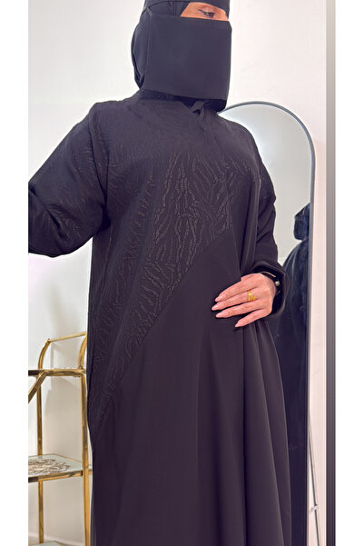 Ratan A half-jacquard abaya with a royal-style button closure at the front; v...