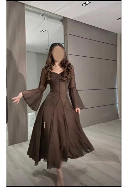 Viola2026 A dress with flowing layers that adds a soft feminine touch and att...