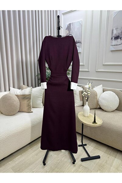 FASHION A burgundy dress with a wide white collar and light front pleats, com...