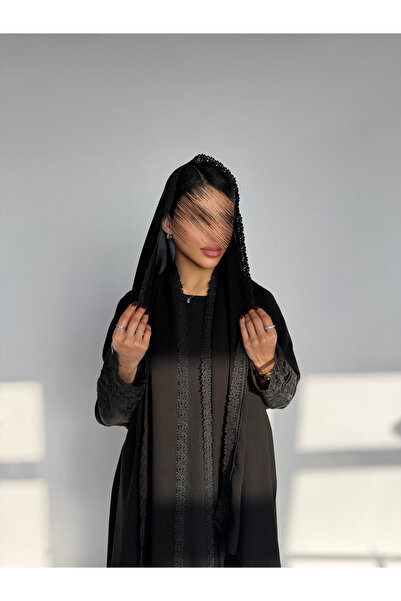 outline A luxurious Eid abaya with a quarter-circle cut, Lace sleeves, and an...