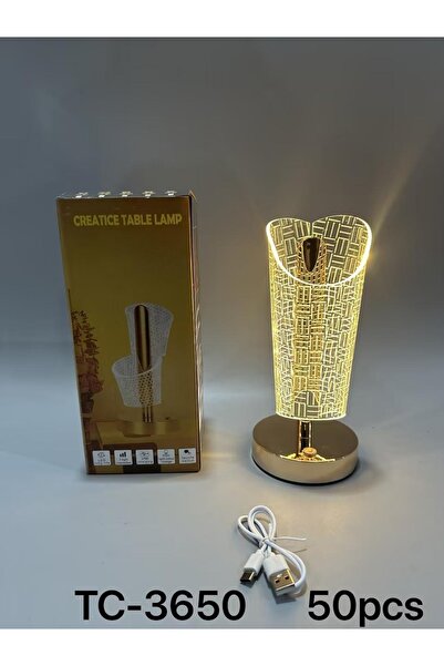 Other A modern table lamp with a gold base and an elegant 3D touch.