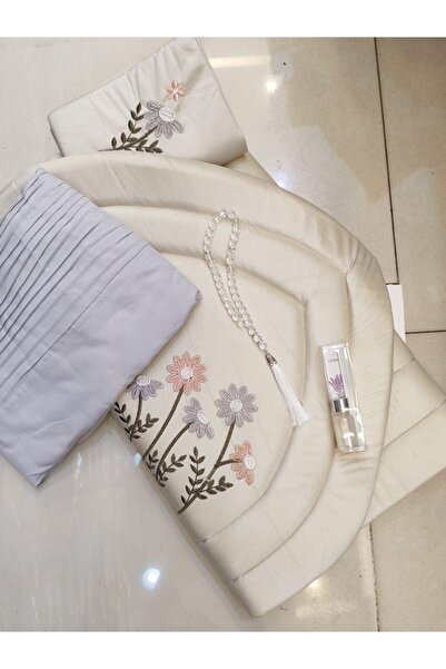 RUG A serene prayer set with a white rug embroidered with light purple flower...