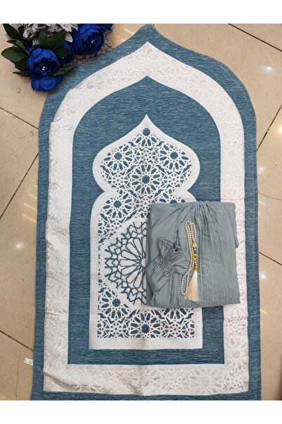 RUG A set that includes a blue rug with white Islamic patterns and a prayer s...