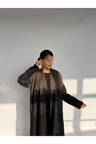 outline A luxurious Eid abaya, quarter-circle style, with a rich brown overla...