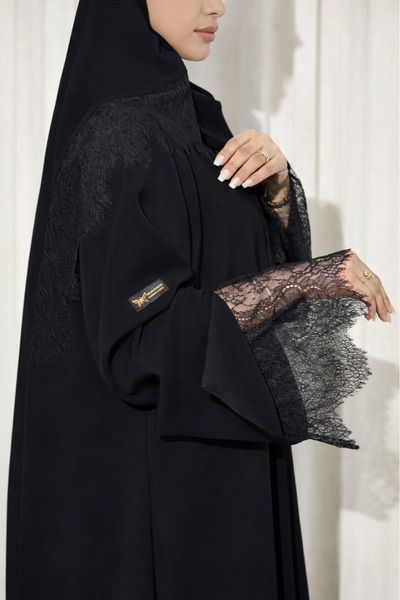Elegant Black balloon abaya in crepe fabric, decorated with lace on the sleev...