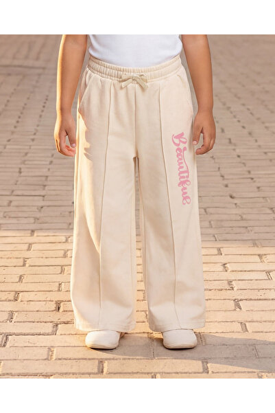 REDTAG Girls Beige Placement Print Track Pants