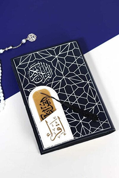 casing A Quran with dark blue leather, featuring delicate white geometric pat...
