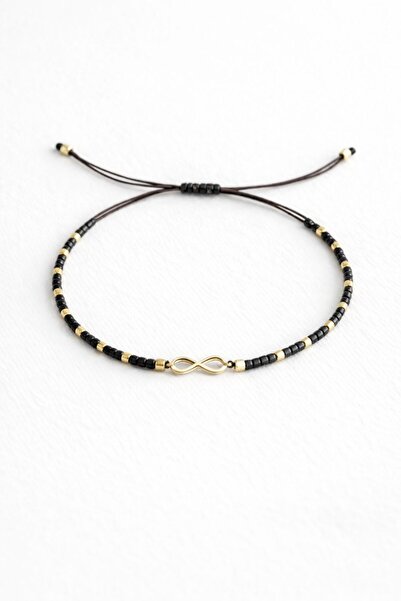 Handmade Thin adjustable Infinity Gold bracelet with black and gold beads