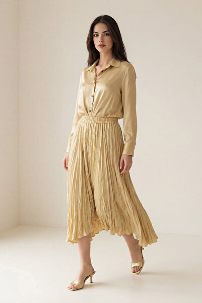 Setre تنورة متوسطة الطول بخصر مطاطي بلون العنبر وتفاصيل مطوية، تصميم مريح