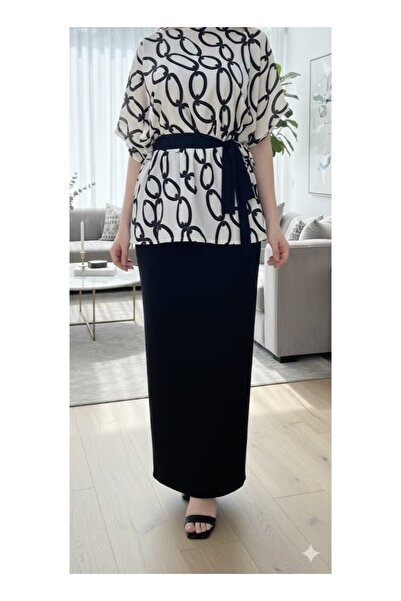 FULLJOY A stylish women's outfit consisting of a short-sleeved blouse and a l...