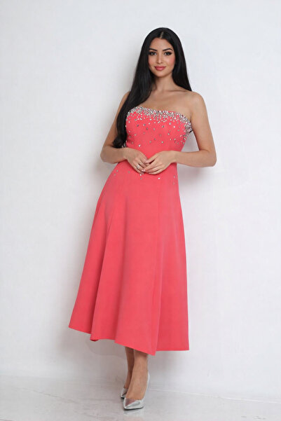 Elegant A neon pink balloon dress adorned with luxurious crystals