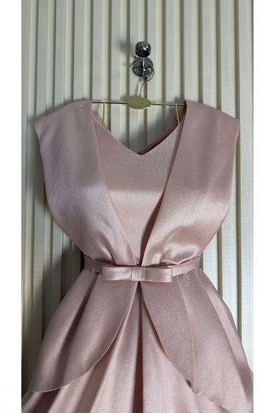 Kayla A midi evening dress with a small, delicate bow in the center, giving i...