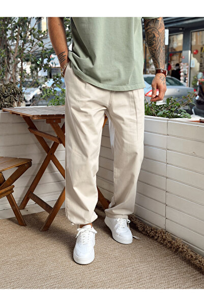 manch collection بنطلون جبردين بأربطة على الأرجل كريمي اللون