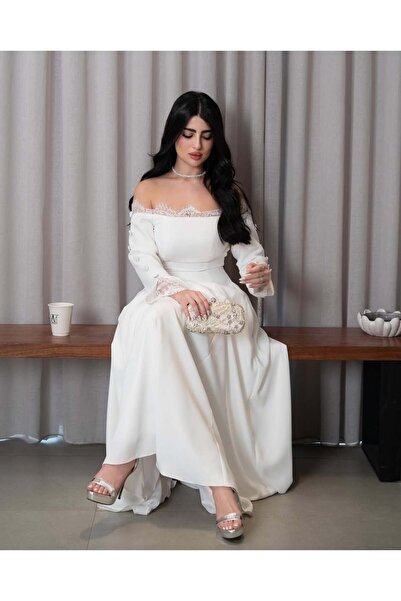 FASHION A soft white dress with Off-Shoulder and Lace details, embodying femi...