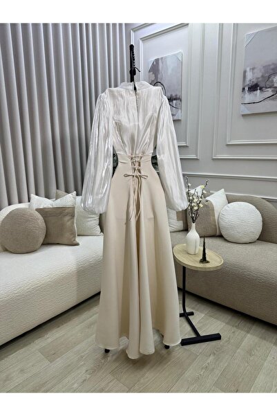 FASHION A beige dress with a tight waist (corset) and shiny puffed sleeves, g...