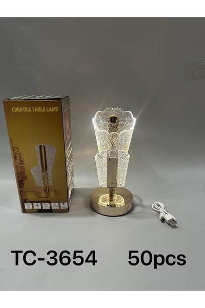 Other A modern lampshade that adds a touch of luxury with its gold base and a...