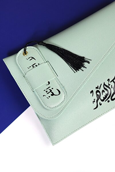 casing A leather Bag in a calm "mint" color, decorated with a congratulatory ...