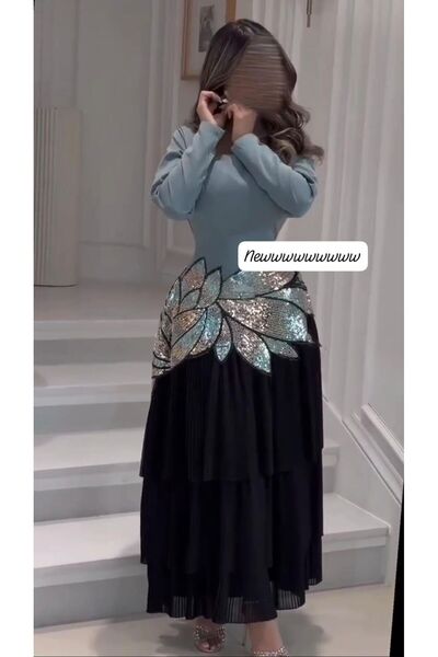 NALA FASHION The dress combines classic elegance with a modern touch.