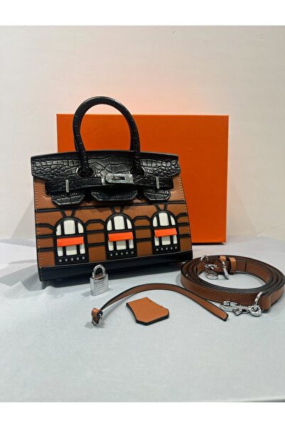 GC A luxurious Clutch Bag with a bold architectural design – a style that com...