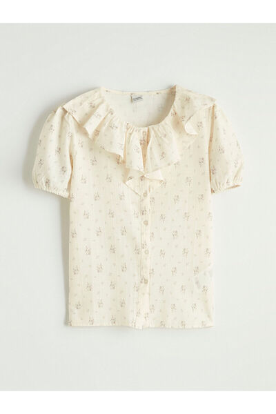 LC Waikiki قميص بناتي من مجموعة إلسيفا باللون البيج مع ياقة مكشكشة وطباعة زهور