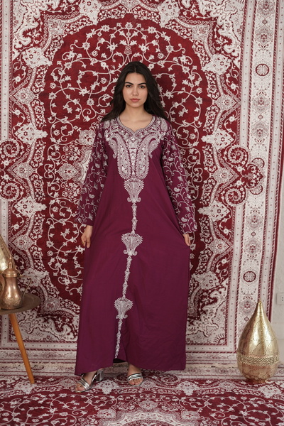 AFandina An elegant jalabiya with embroidered details that reflects a luxurio...
