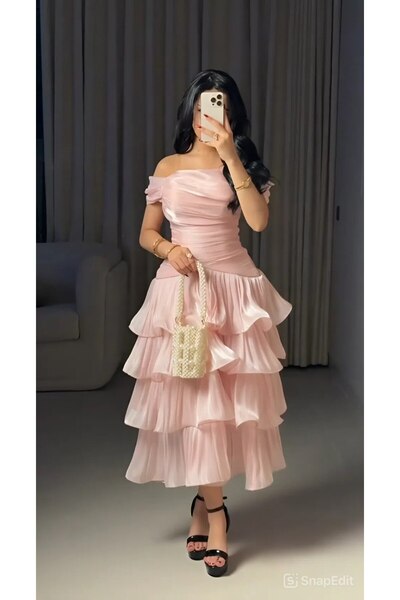 Viola2026 An elegant pink dress with a soft, feminine design, featuring an of...