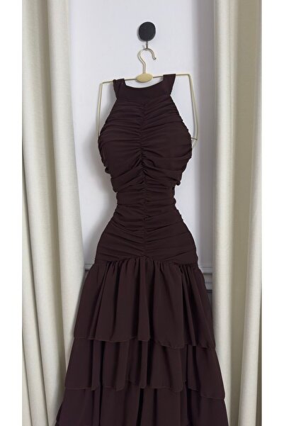 Viola2026 An elegant dress in a dark brown color with an attractive design th...