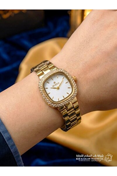 Mirra Classic gold women's wristwatch with crystal embellishments, complete g...